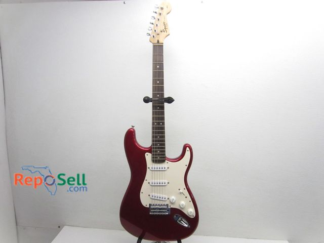 Lot 31-6112 - Squier By Fender Electric Guitar And Stand