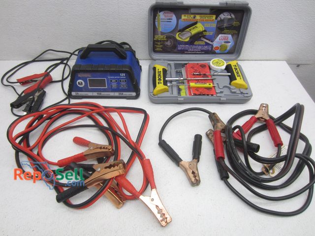Lot 31-4527 - (2) Sets Jumper Cables, Tire Repair Kit, Traveller 12V Battery Charger, etc.