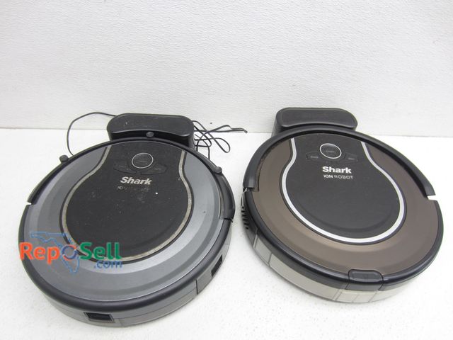 Lot 31-8103 - (2) Shark Ion Robot Vacuums w/Charging Stations: 1- Powered On