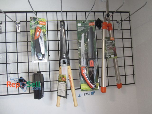 Lot 31-1217 - Stihl New Accessory Lot: Shears, Pruning Saw, Sheaths, ETC - Rack not included