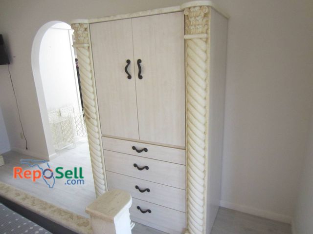 Lot 31-8618 - Cream And White Armoire With Carved Spiral Columns And Four Drawers - Bring Labor