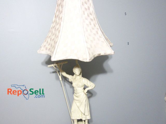 Lot 31-9015 - Metal Lamp Featuring Woman Figurine Base, Cream Fabric Shade, Standing 34 Inches Tall.