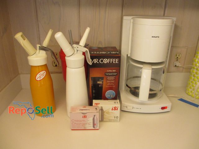 Lot 31-1197 - Misc Coffee Items: Krups Coffee Maker - Powers On, Mr. Coffee Grinder, (2) Creamers w/Chargers/CO2