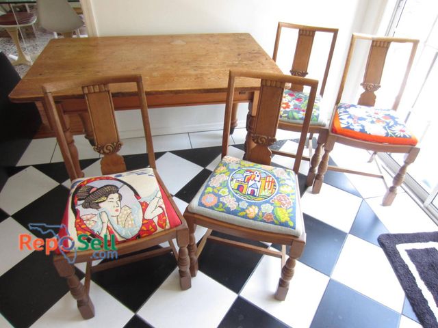 Lot 31-9399 - Wooden farmhouse-style table and 4 Chairs. Featuring a rectangular top with measurements approximate...
