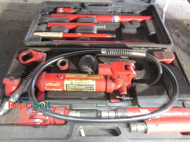 Lot 31-1280 - Hydraulic porta power kit includes multiple attachments and extensions. Case shows moderate wear. In...