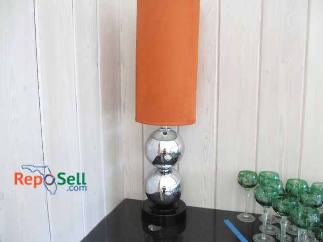 Lot 31-1463 - Runaround Lamp With Carrot Velvet Lampshade And Chrome Base - Power Cord Is Pinched Behind Shelves