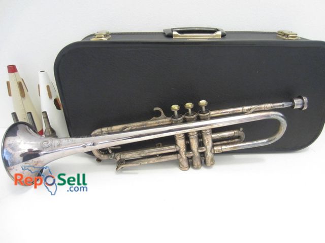 Lot 31-9060 - Invicta Trumpet etched by Boosey & Hawkes, London. Includes case, mutes, and mouthpieces.
