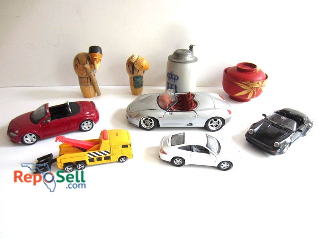 Lot 31-9152 - Lot featuring five toy cars, including a red convertible, silver convertible, black sedan, white spo...