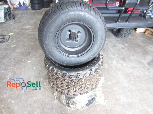 Lot 31-1267 - (3) Tires and (1) 4-Lug Wheel: Loadstar 205/65-10, 22x11.00-12, And CST 20x9-12, 10-Inch And 12-Inch...