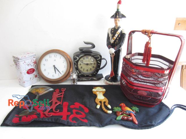 Lot 31-9175 - A red lacquered multi-tiered basket with tassels, a ceramic figurine of a uniformed soldier, two tab...