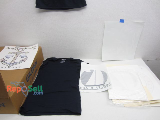 Lot 31-4073 - (24) New XS Gildan Shirts With (90) Iron Ons