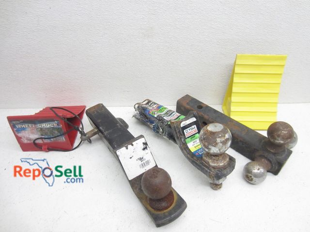 Lot 31-6114 - (3) Trailer Hitches And (2) Wheel Chocks: 2", 2 5/16" And 3-Ball