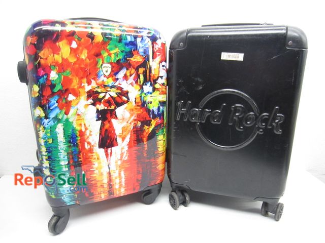 Lot 31-9361 - (2) Rolling Hard Case Luggage Carry On Size