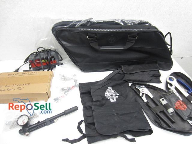 Lot 31-6107 - (2) New Motorcycle Side Saddle Bags And Harley Acces: Tools, ACY Adapter, Charger etc