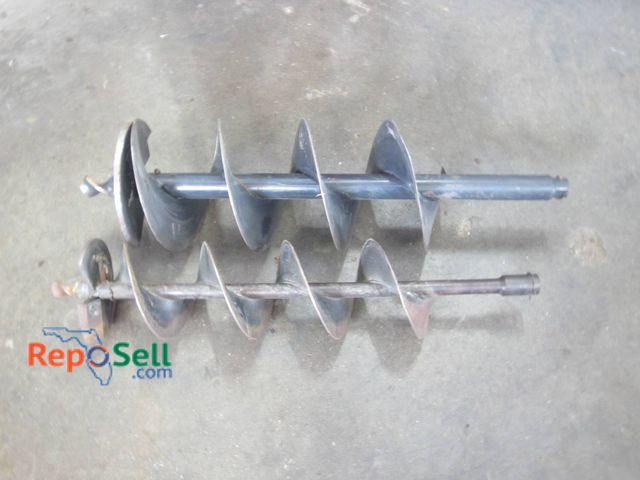 Lot 31-1292 - Two Steel Auger Drill Bits Featuring A Helical Configuration For Earth Drilling. One Bit Is Larger I...