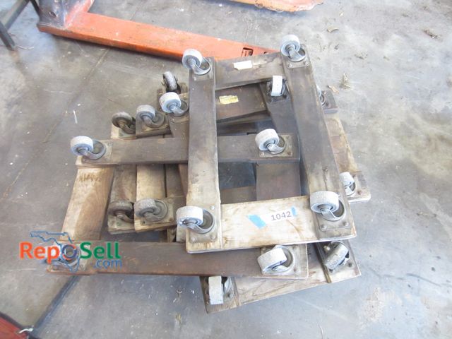 Lot 31-1042 - (7) four-wheel floor dollies.