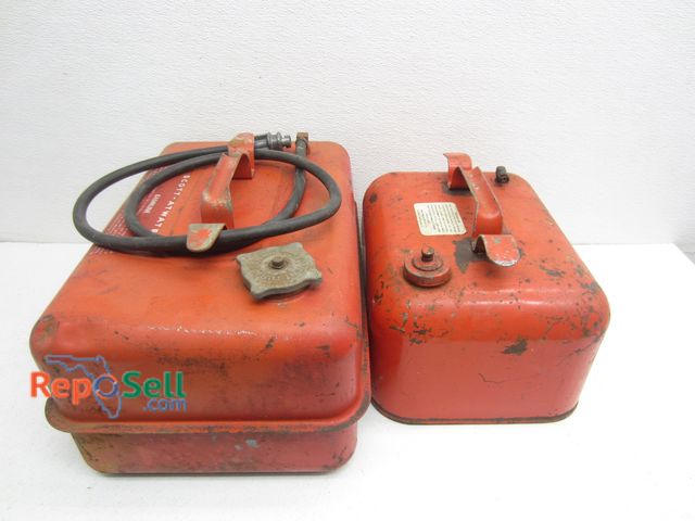 Lot 31-9549 - (2) Vintage Outboard Tanks