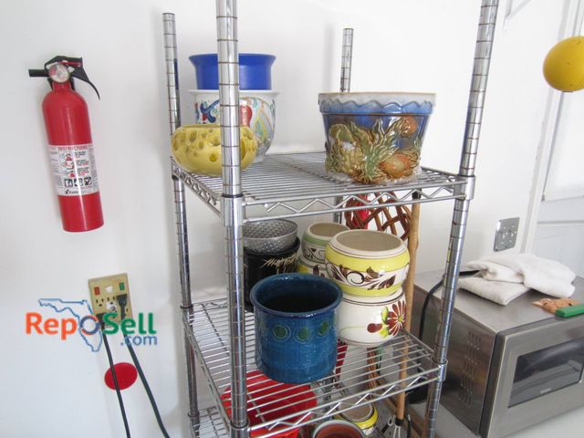 Lot 31-9137 - Metal shelving unit and Contents: 71 inches in height and 18 inches in depth. Comes with an assortme...