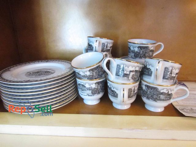 Lot 31-9239 - Schippenbeil Porcelain coffee set featuring cups and plates adorned with scenic architectural motifs...