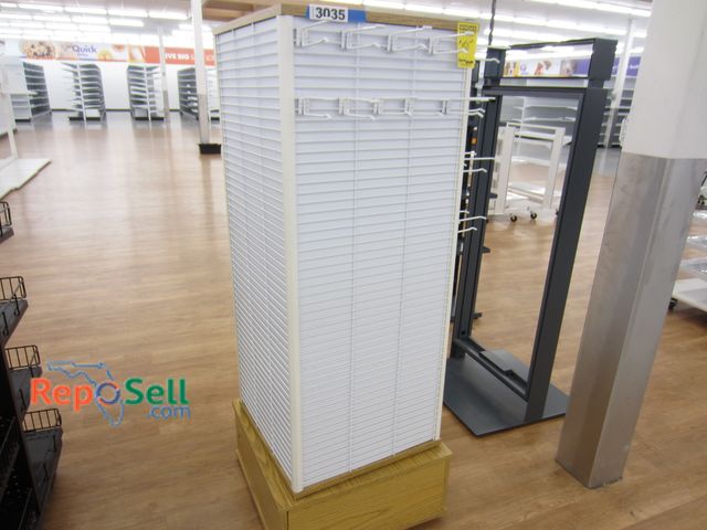 Lot 31-3035 - Spinning Retail Stand. 4 - 1'8" sides. Height 5'
