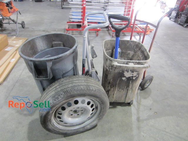 Lot 31-8194 - (3) Garbage Cans, Moving Dolly, Portable Table Saw Stand, Spare Tire etc