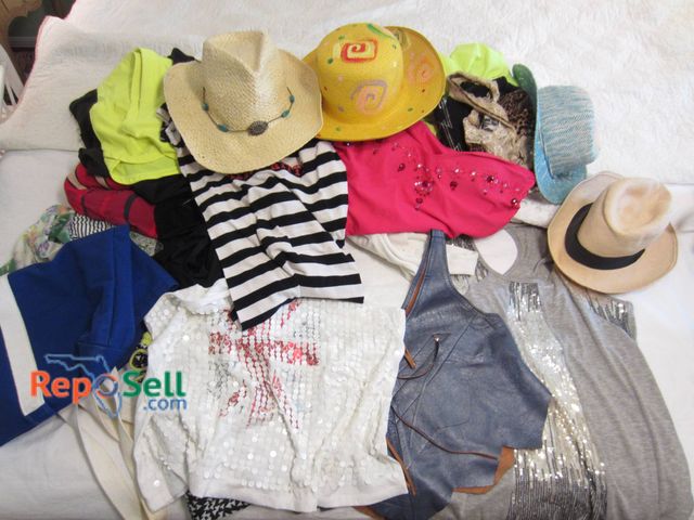 Lot 31-9103 - Various Shirts, Hats, And Bags From Brands Like Julie's Closet And Rising Sun.