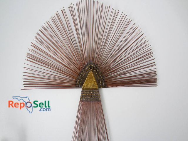 Lot 31-9109 - Copper Wall Sculpture Featuring Radiating Rod Design And Triangular Gold Colored Centerpiece.