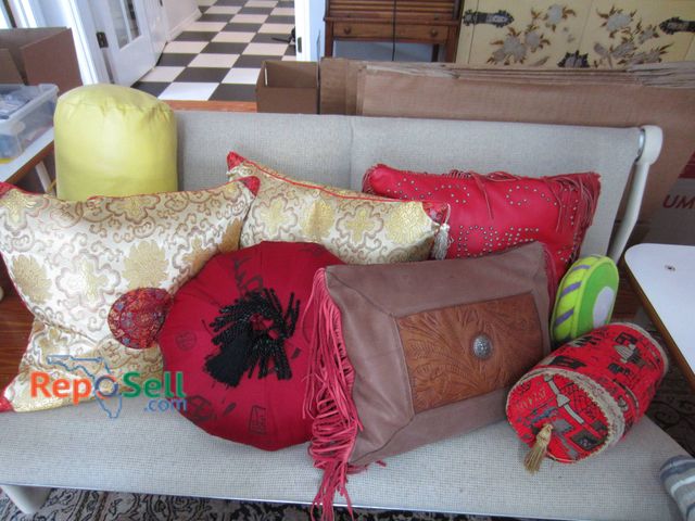 Lot 31-9223 - (8) Decorative throw pillows featuring a variety of designs and materials.