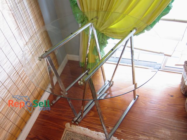 Lot 31-9007 - Round Glass Top Table With Metal Chrome Trestle Base; Height And Diameter Visible.