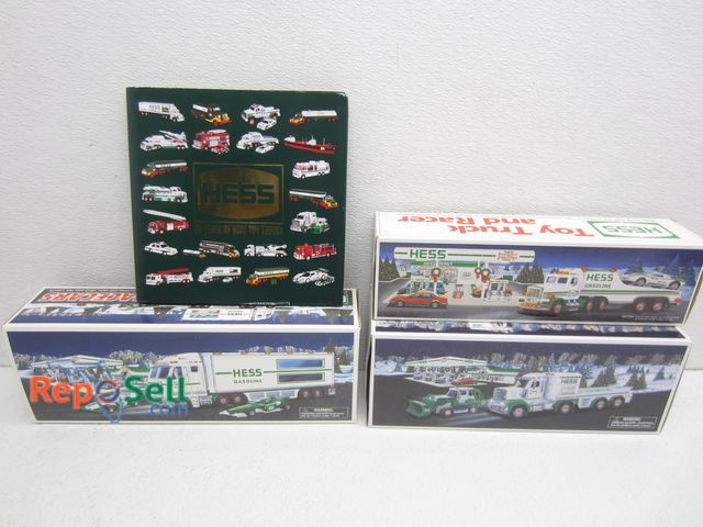 Lot 31-1065 - (3) Hess Trucks With Original Boxes And Hess 50 Yrs Book