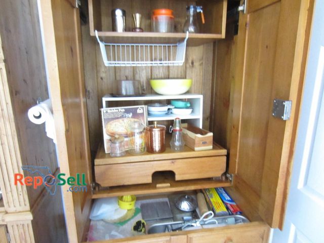 Lot 31-9155 - Contents of Upper Cabinet: Including assortment of kitchen accessories. Included are nonstick quiche...