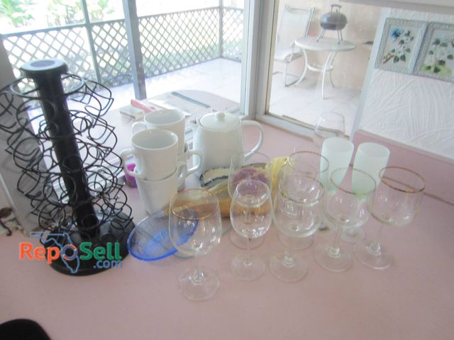 Lot 31-8674 - Lot Of (16) Glassware, Coffee Mugs, Teapot, And Metal Cup Holder Stand