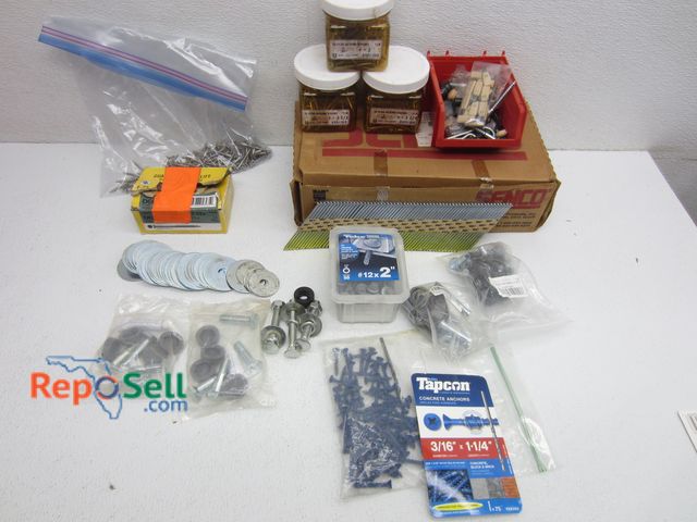 Lot 31-1379 - Hardware Lot: Almost Full Box of Senco 3.5" x .131" Nails, Tapcon, etc.
