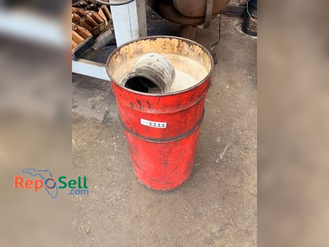 Lot 31-1111 - Oil drum with oil dry.
