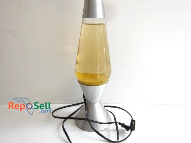 Lot 31-9311 - Vintage-style lava lamp featuring a silver-tone metal base and cap with a tapered design. The glass ...