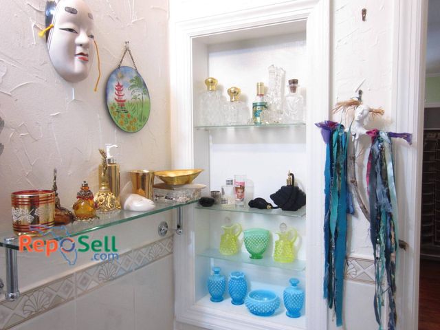 Lot 31-9320 - Decorative glass Decor. Includes an array of clear glass bottles, some with gold-toned stoppers, a b...
