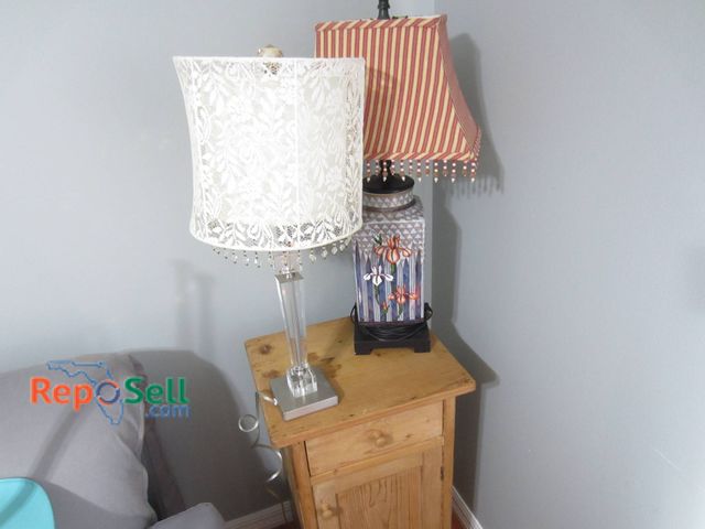 Lot 31-9023 - Lace-Trimmed Crystal Lamp, Floral Ceramic Lamp, And Light Brown Wood Side Table.