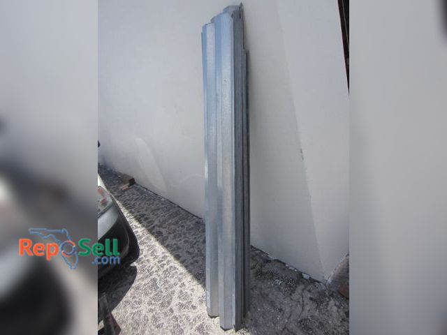 Lot 31-6261 - (31) Galvanized Metal Storm Shutters 72"-85"