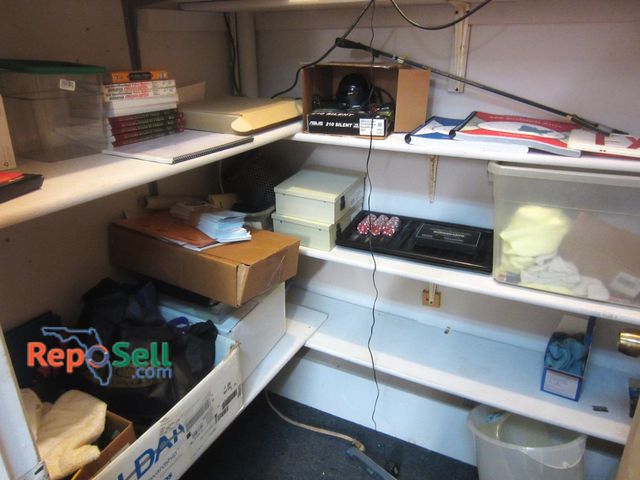 Lot 31-2121 - Contents of (4) Shelves in Closet: New Poker Books, Power Supplies, Poker Chips - Does Not Include D...
