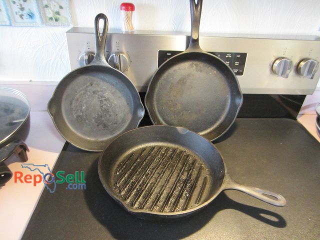 Lot 31-8669 - 3 Cast Iron Skillets: Griswold, Wagner Erie PA Griddle Pan And Lodge