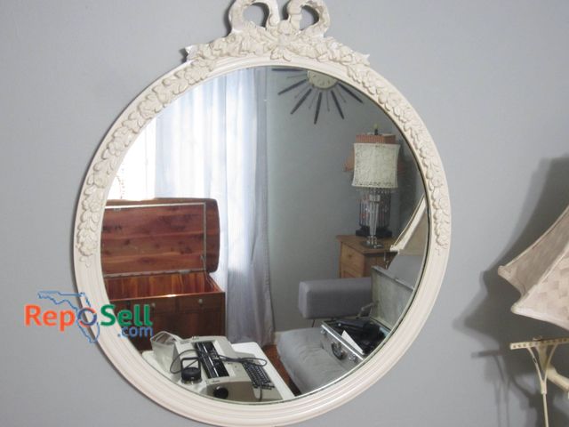 Lot 31-9014 - Round Mirror With Ornate Floral Motif Frame, White Finish, Approximately 28-Inch Diameter.