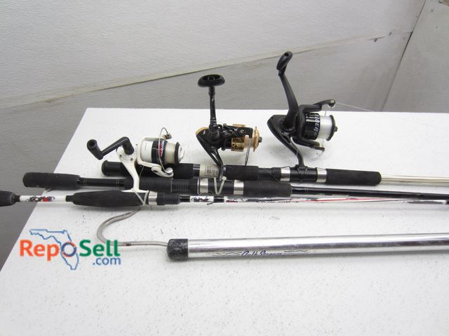 Lot 31-1288 - (3) Fishing Poles with reels and gaff hook: Abu Garcia, Tiger, Tsunami