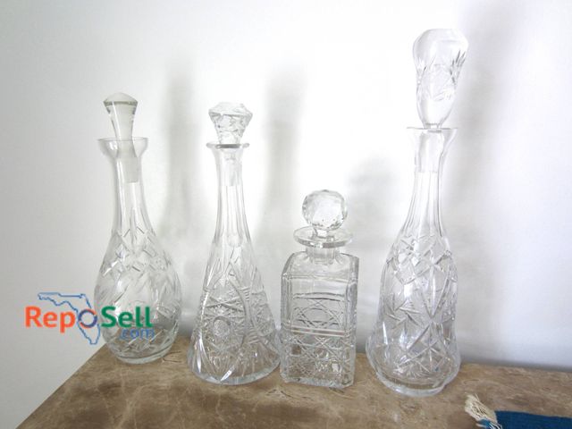 Lot 31-9107 - Four Cut Glass Decanters, One Marked Edinburgh Crystal, In Varied Designs And Sizes.