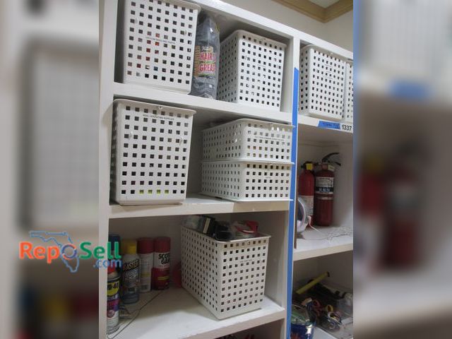 Lot 31-1338 - Contents of Left Side of Shelves: Tool Box, Tape Guns, Velcro, etc.