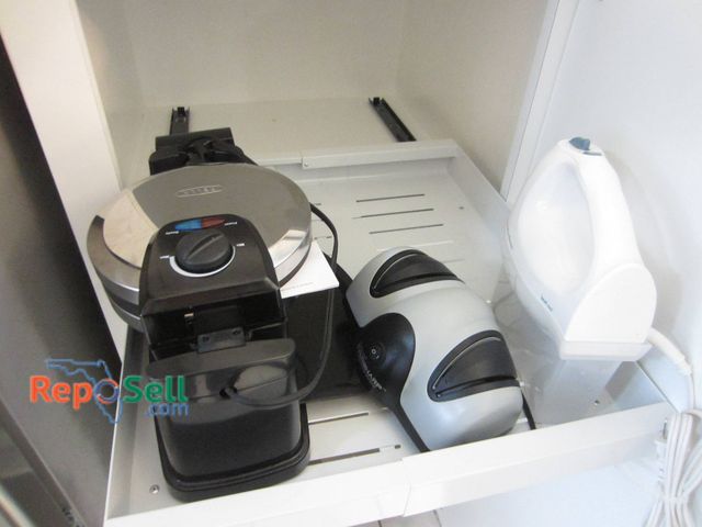 Lot 31-8671 - 3 Small Kitchen Appliances: Bella Rotating Waffle Maker, Hamilton Beach Hand Mixer, Presto Eversharp...