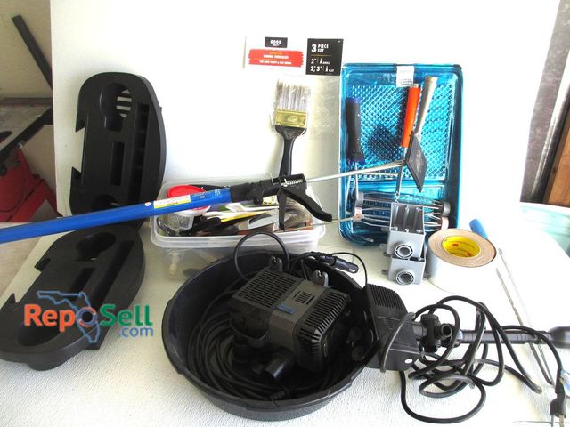 Lot 31-8592 - Tool Lot: Painting Supplies, Cargo Bar, CreekStone Submersible Pond Pump And Car Adapter