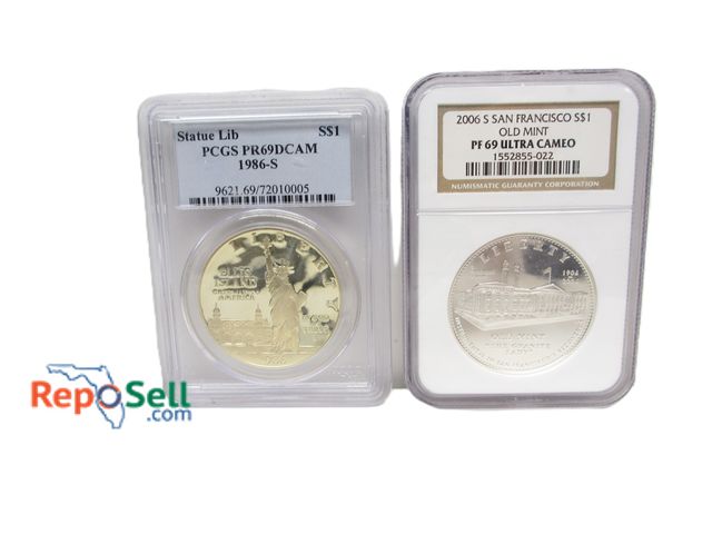 Lot 31-4003 - (2) Graded Silver Dollars: 2006S Old Mint San Francisco PF69 and 1986S Ellis Island Statue of Libert...