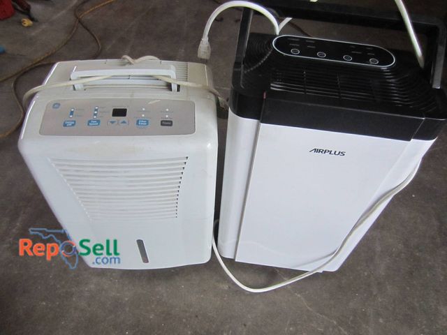Lot 31-1365 - Two Dehumidifiers. One Is A GE Model Featuring Adjustable Humidity Levels, A Digital Display, And Cu...