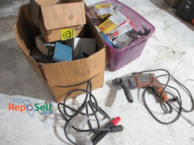 Lot 31-8136 - Tool/Hardware Lot: Ridgid Drill (powers on) R7111, Sand Paper, Welding Lead, etc.