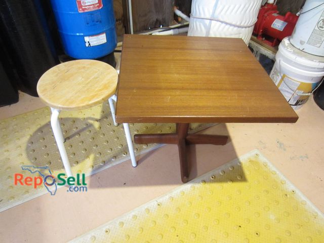 Lot 31-9218 - A square side table with a wood top measuring approximately 24 x 20 inches tall, featuring a central...